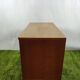 Wooden chest of drawers with gilded handle