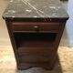 Solid oak bedside table with black marble.