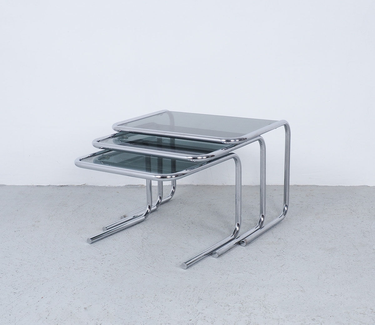 Vintage chromed nesting tables with smoked glass