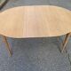 Table à manger scandinave ronde extensible décapée en teck brut 1950