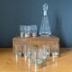 Liquor decanter in crystal and silver metal and matching glasses thereof