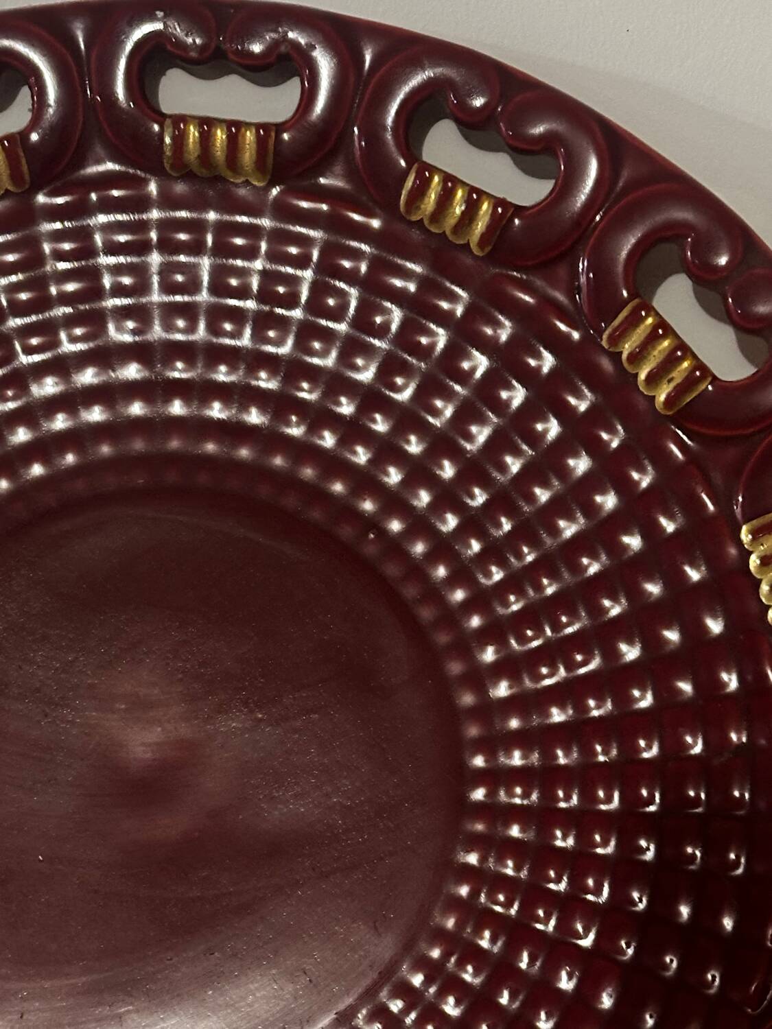 Burgundy and gold openwork plate in ceramic from Saint-Clement, 1950s.