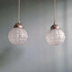 Art Deco trio of frosted glass pendants, 1920s-30s.