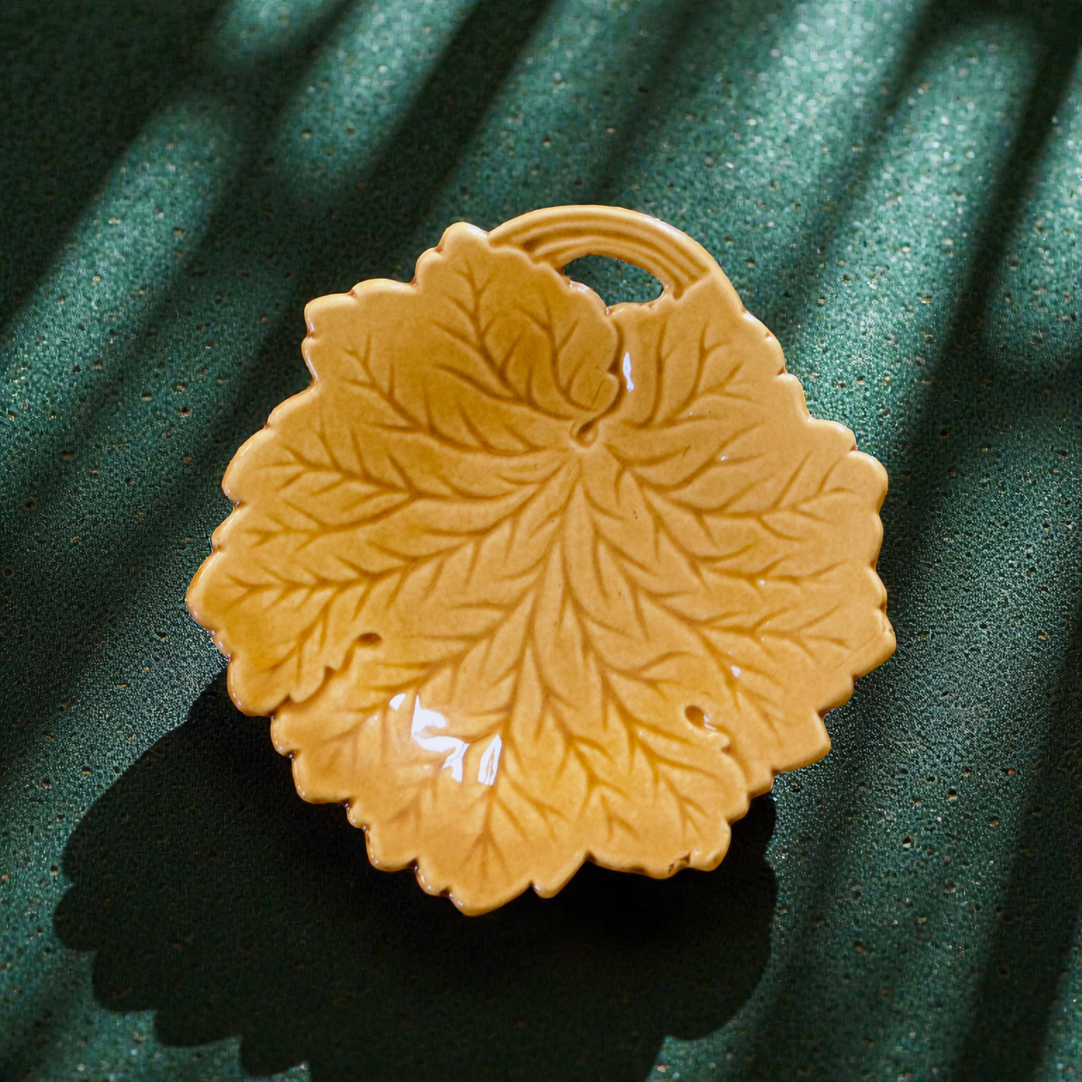 Vintage soap dish in ochre faience, leaf shape.