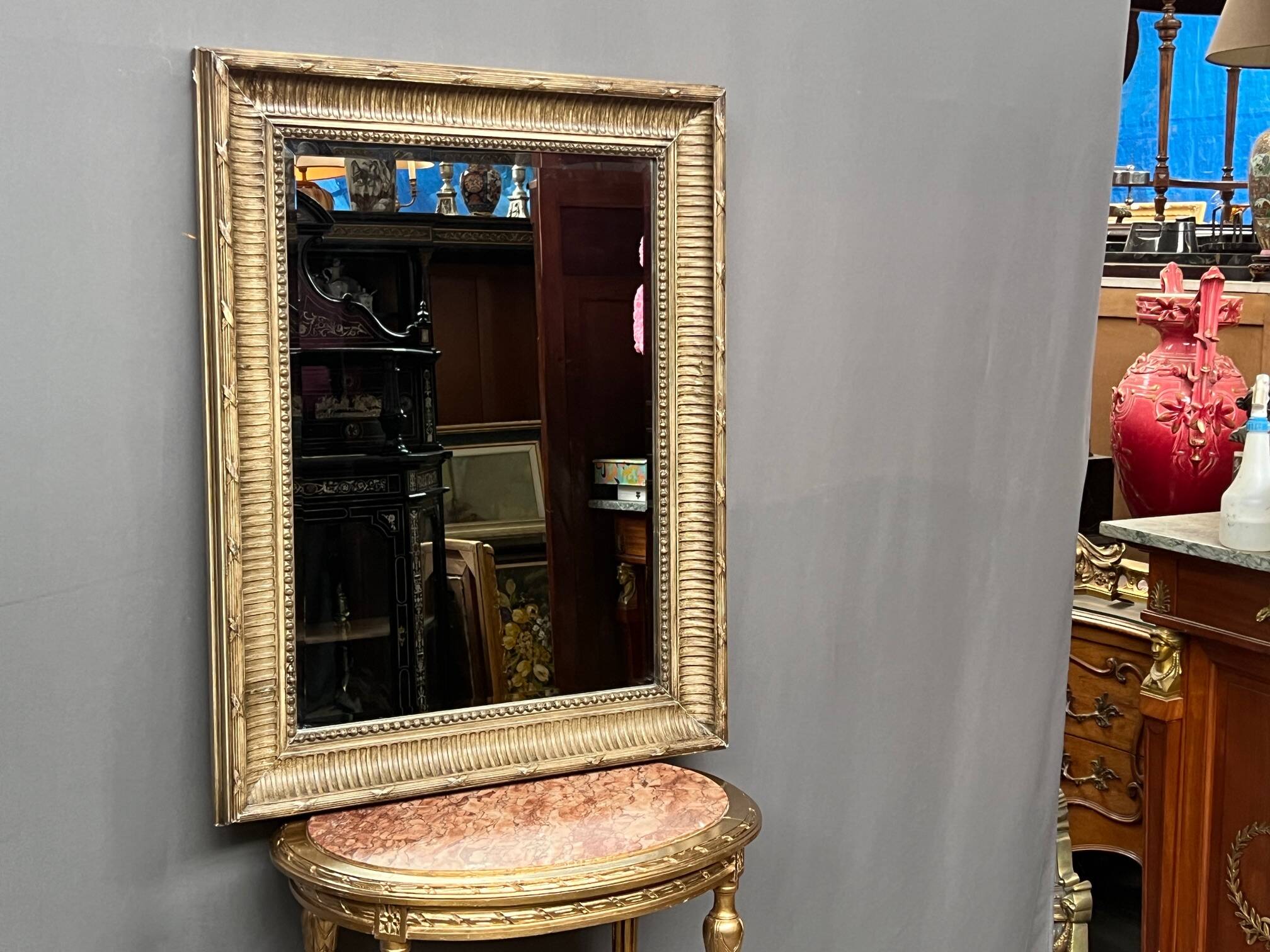 Mirror in a frame with a moulding.
