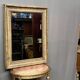 Mirror in a frame with a moulding.