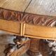 Oval oak table with carved details - known as a hunting table.