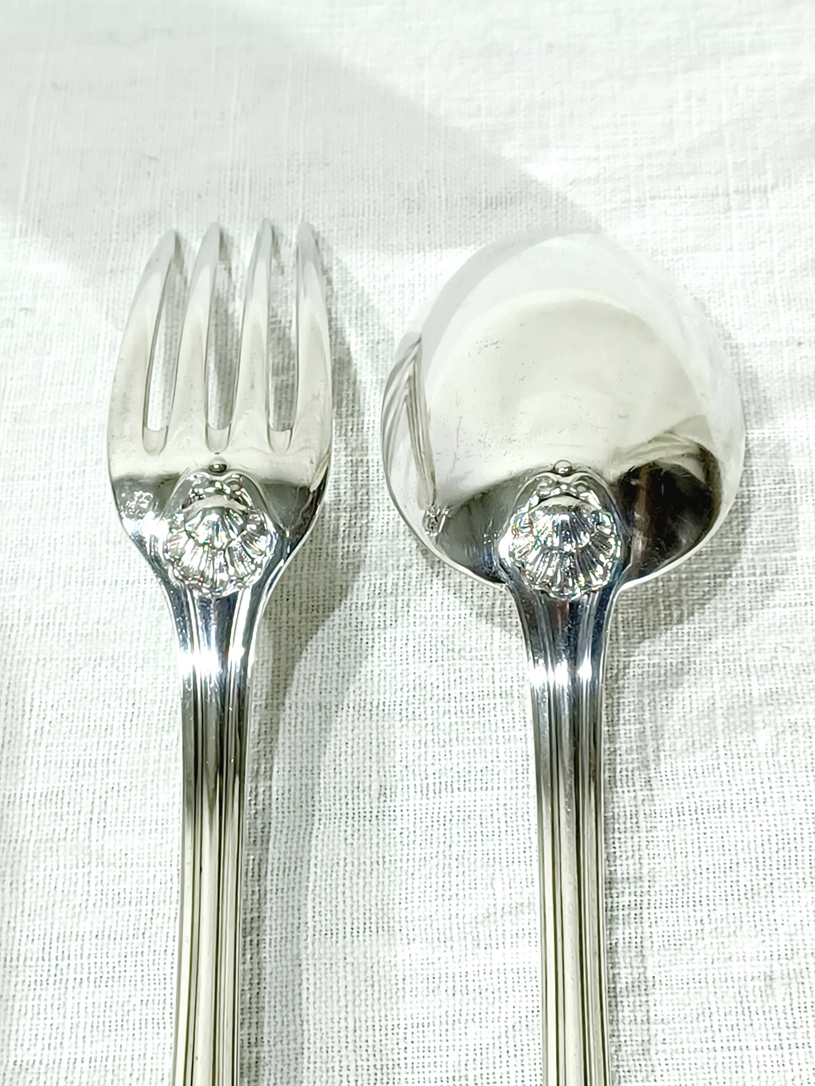 12 Louis XIV style silver cutlery sets