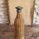 Woven wicker bottle
