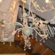 Large cage chandelier in aged metal.