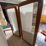 Pair of rounded mirrored wardrobes