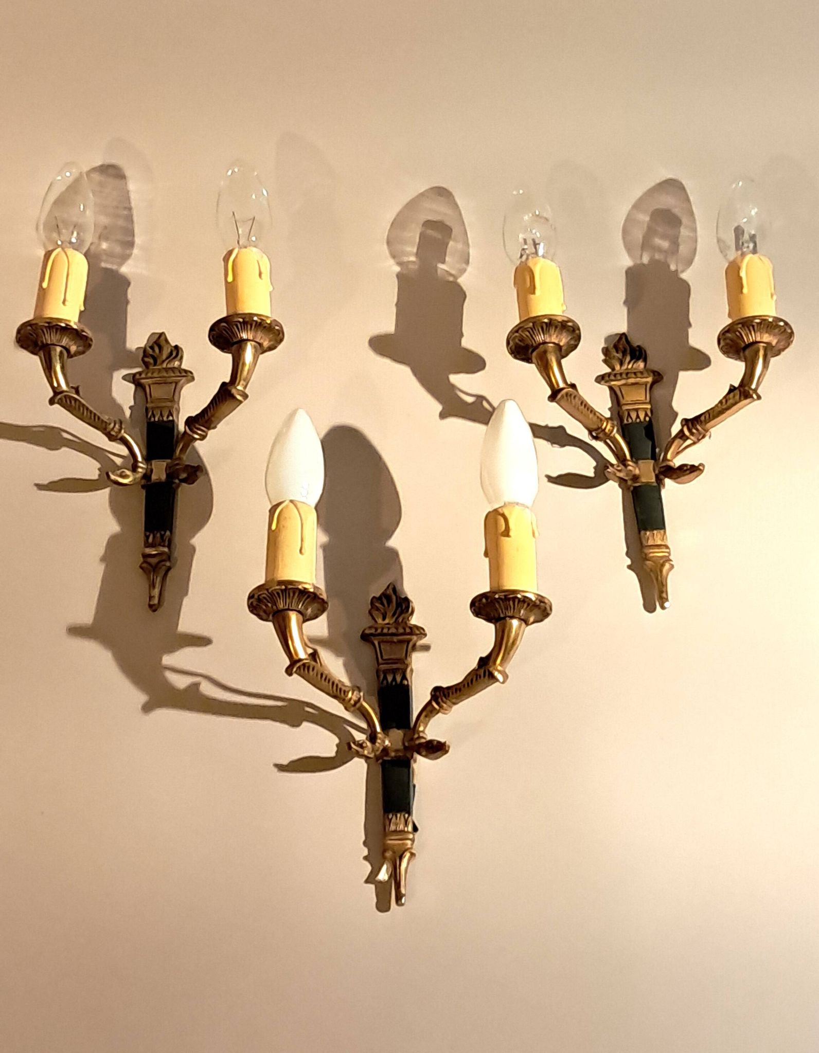 Set of 3 Empire style wall lights in bronze and gilded and green lacquered brass, Circa 1950.
