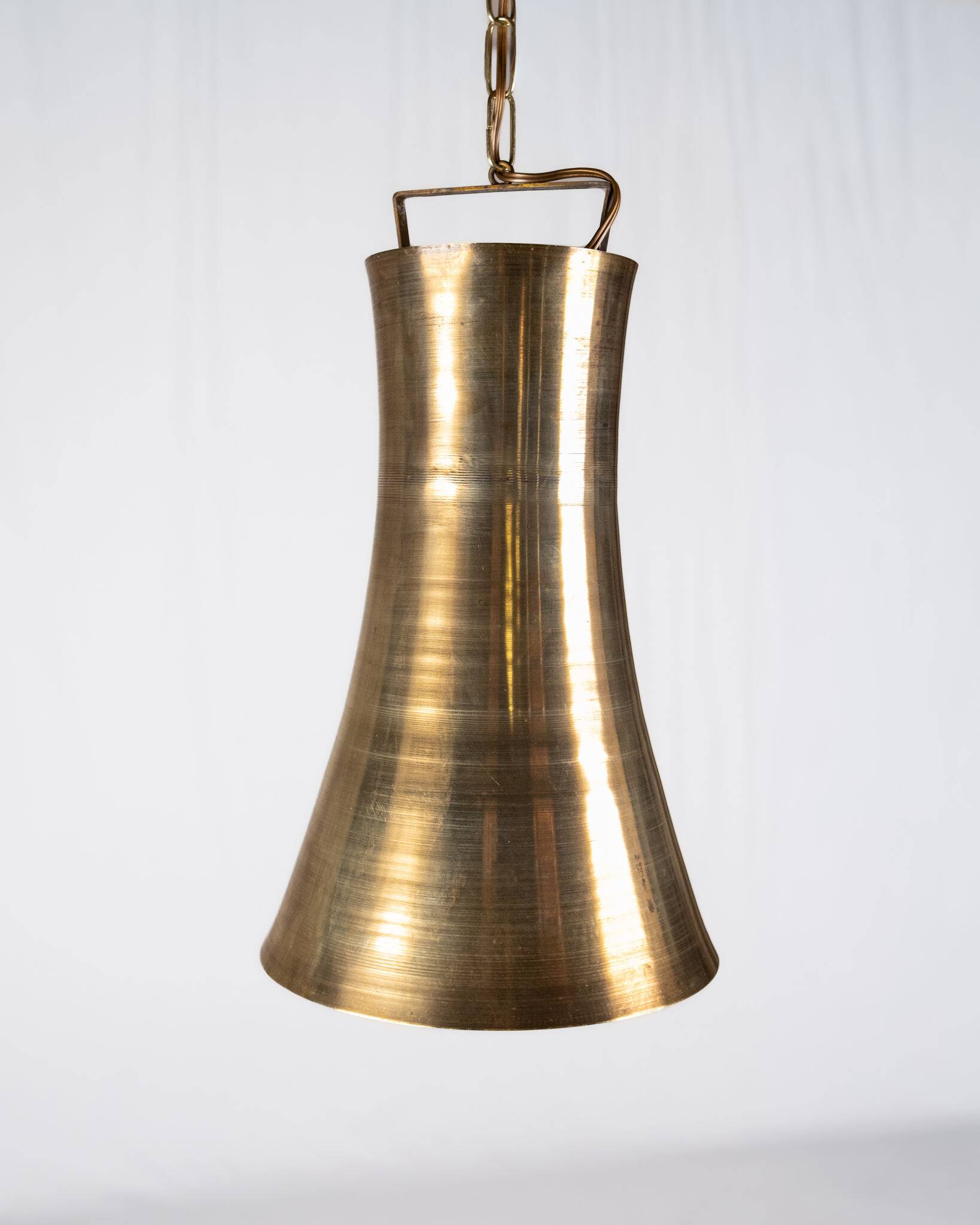 Pair of brass pendants, hourglass shape, 1960s