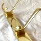 Vintage gold aluminum coat rack with three hooks