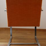 Chrome-plated metal and orange fabric armchair, 1970