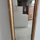 Long wooden mirror and gilded stucco with pearl rays H: 2m45 L: 40cm