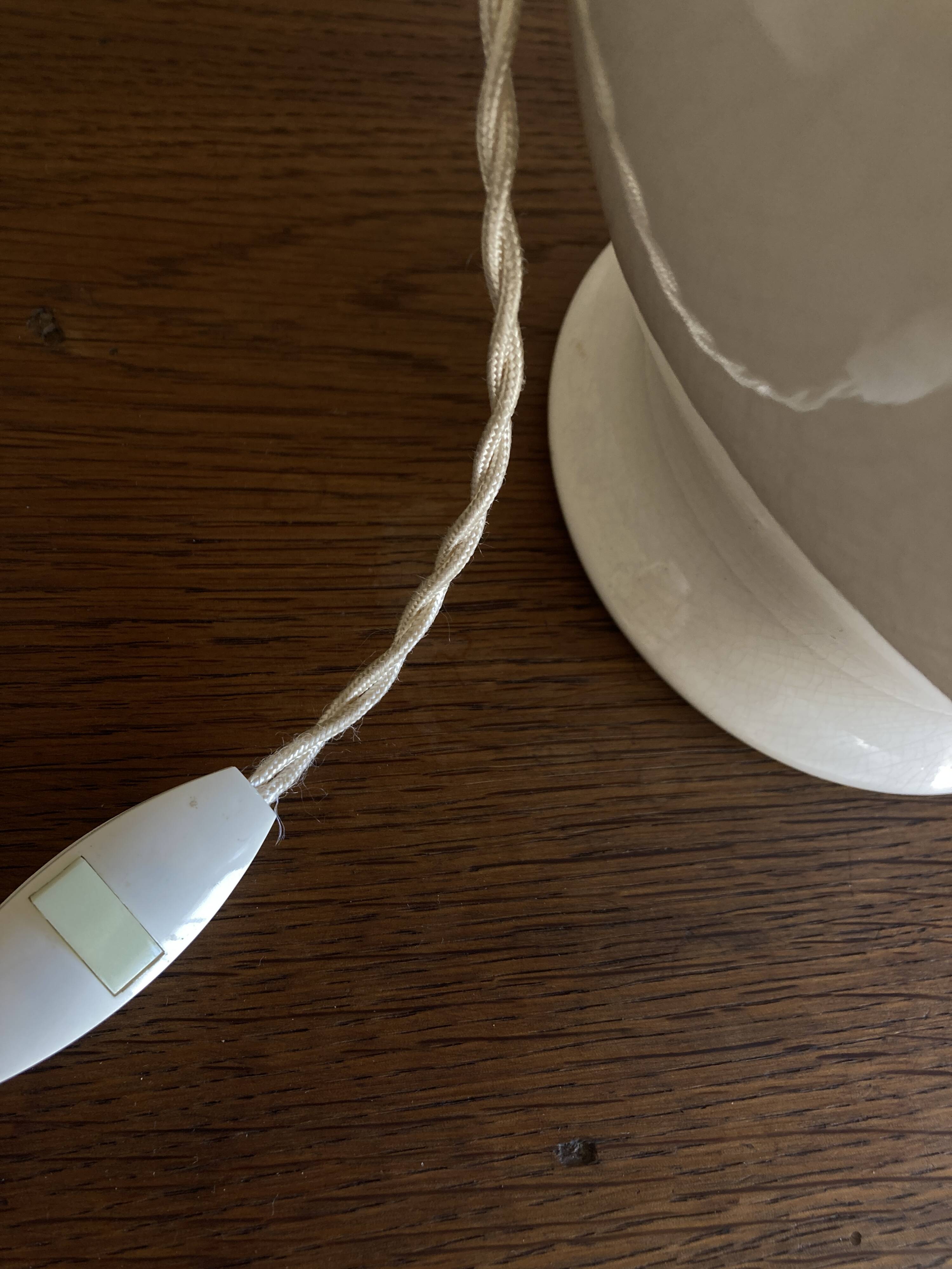 Neo-classical baluster lamp in cracked white earthenware from the 1970s.