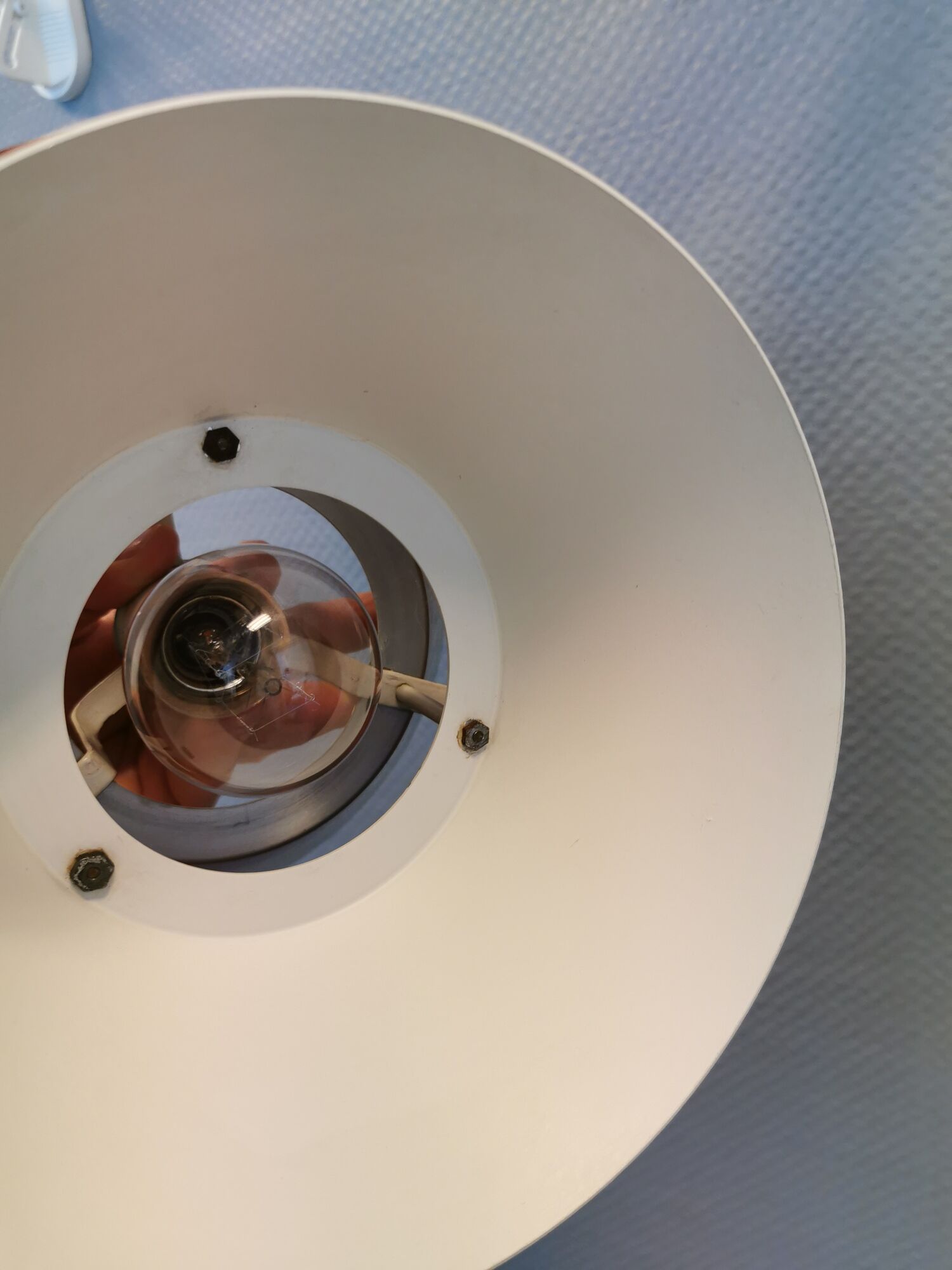 Hanging lamp,  of silver coloured aluminium with black "ring" and orange inner contrast lacquer.