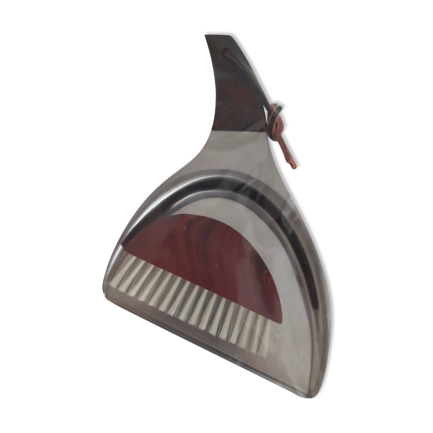 Picks up new vintage shovel and sweeper crumbs