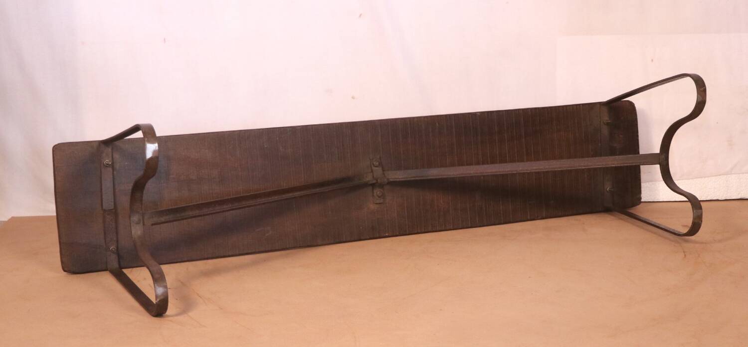 Old bench in Burmese teak with a wrought iron base.