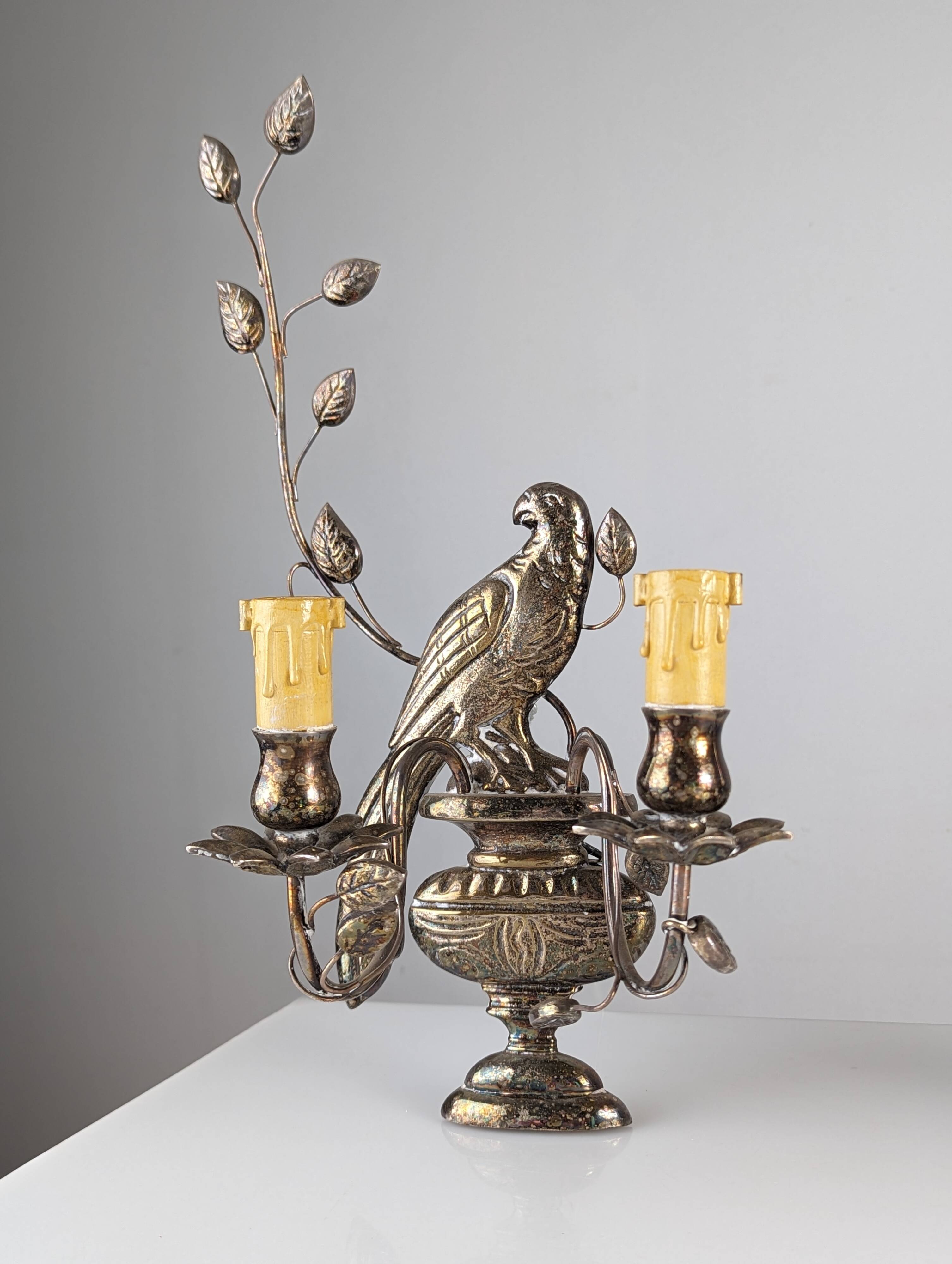Pair of wall sconces with parrots and leaves