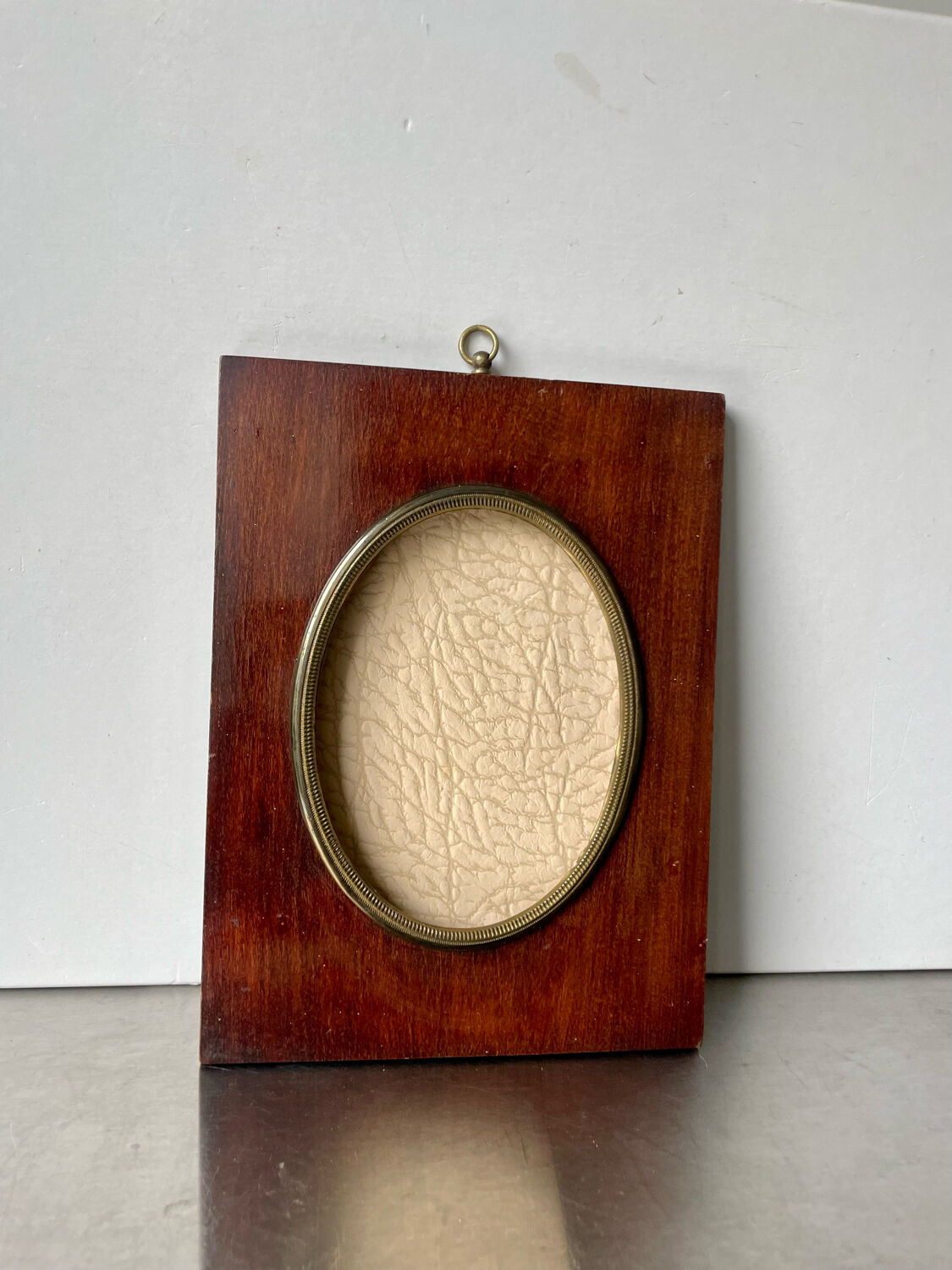 Mahogany wood frame with brass borders