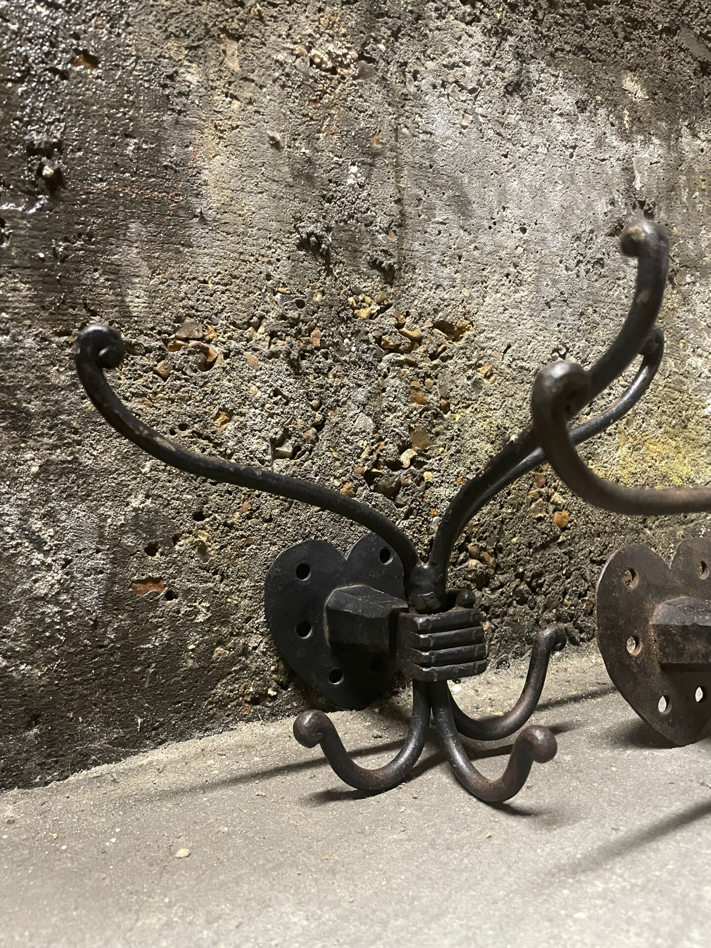 Brutalist pair of wall-mounted coat hooks.