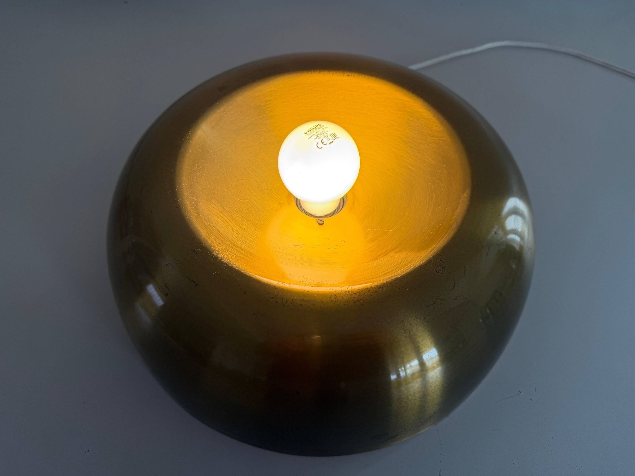 Flush-mounted disc-shaped brass fixture from the mid-century, 1960, Italy.