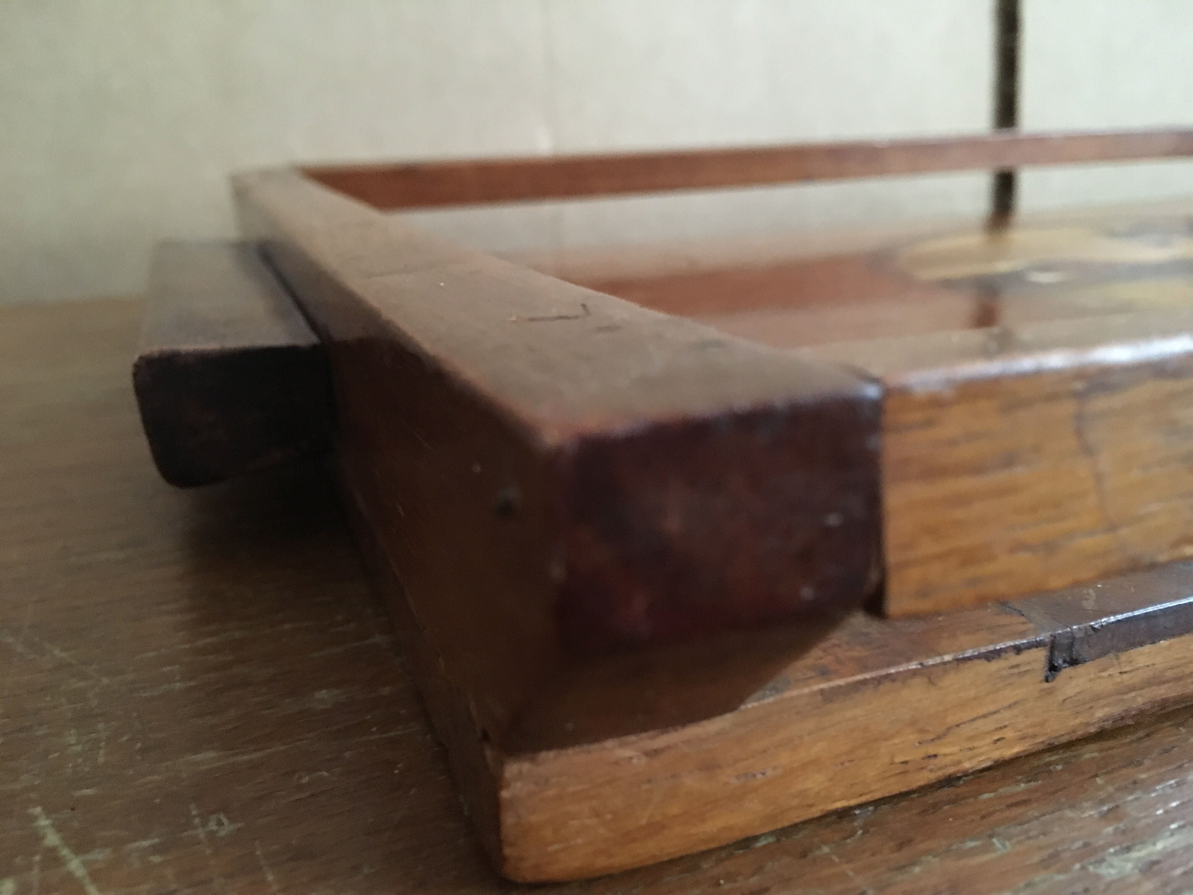 Old wooden serving tray with marquetry drawing