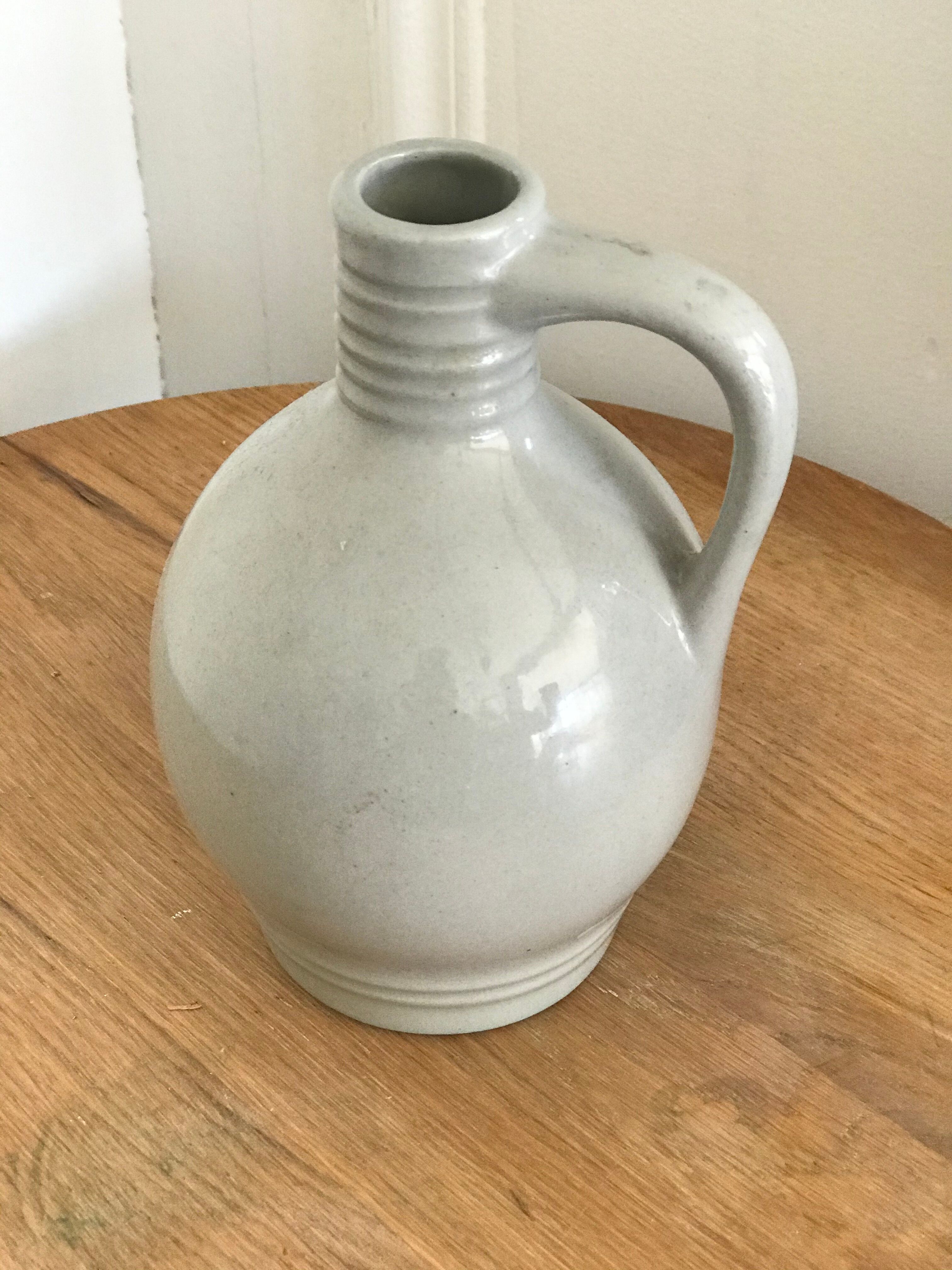 Pitcher with ceramic handle