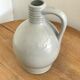 Pitcher with ceramic handle