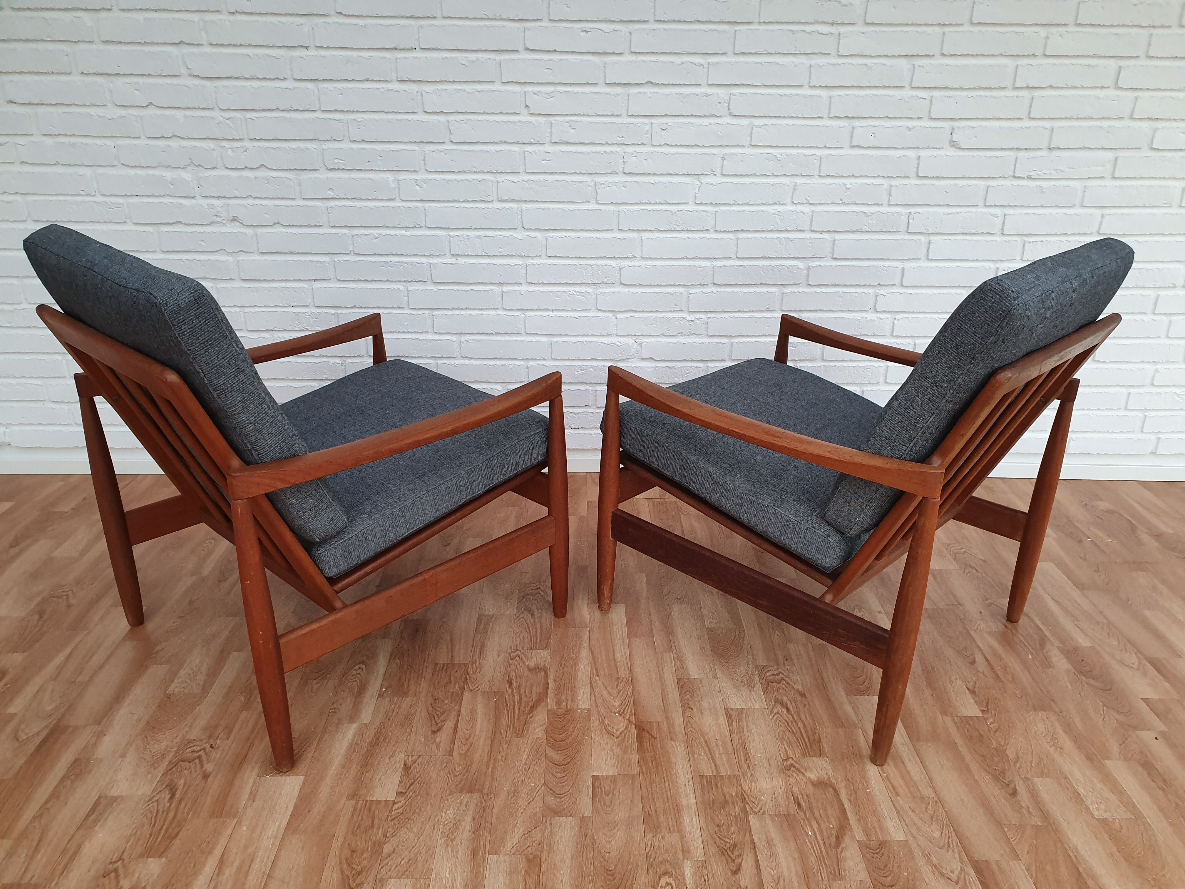 A pair of Danish armchairs, teak, wool, leather