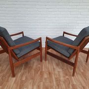 A pair of Danish armchairs, teak, wool, leather