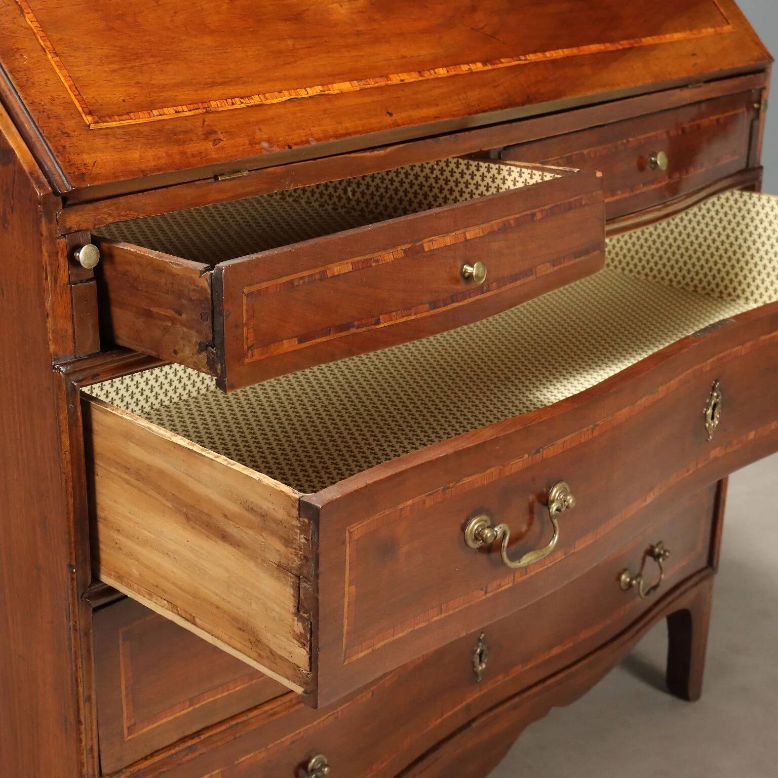 Antique drop-leaf cabinet in walnut with maple inlays, Italy, mid-18th century.
