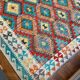 Oriental kilim rug afghan colored red and multicolored