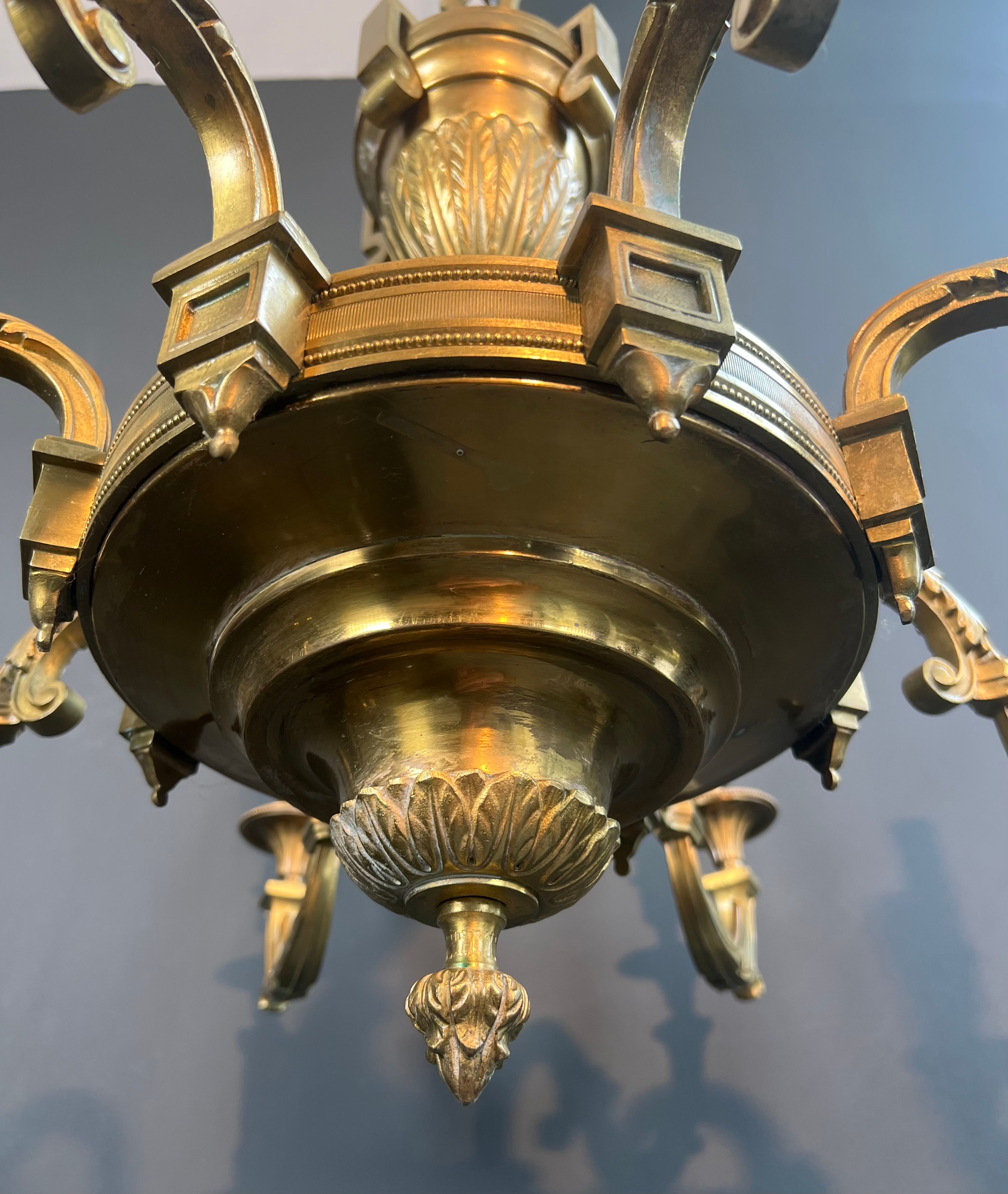 Important Louis XVI style chiseled bronze chandelier with 8 light arms by Lucien Gau