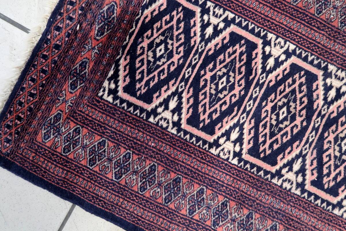Handmade vintage 1960s Uzbek Bukhara rug – small wool tribal carpet (65cm x 95cm)
