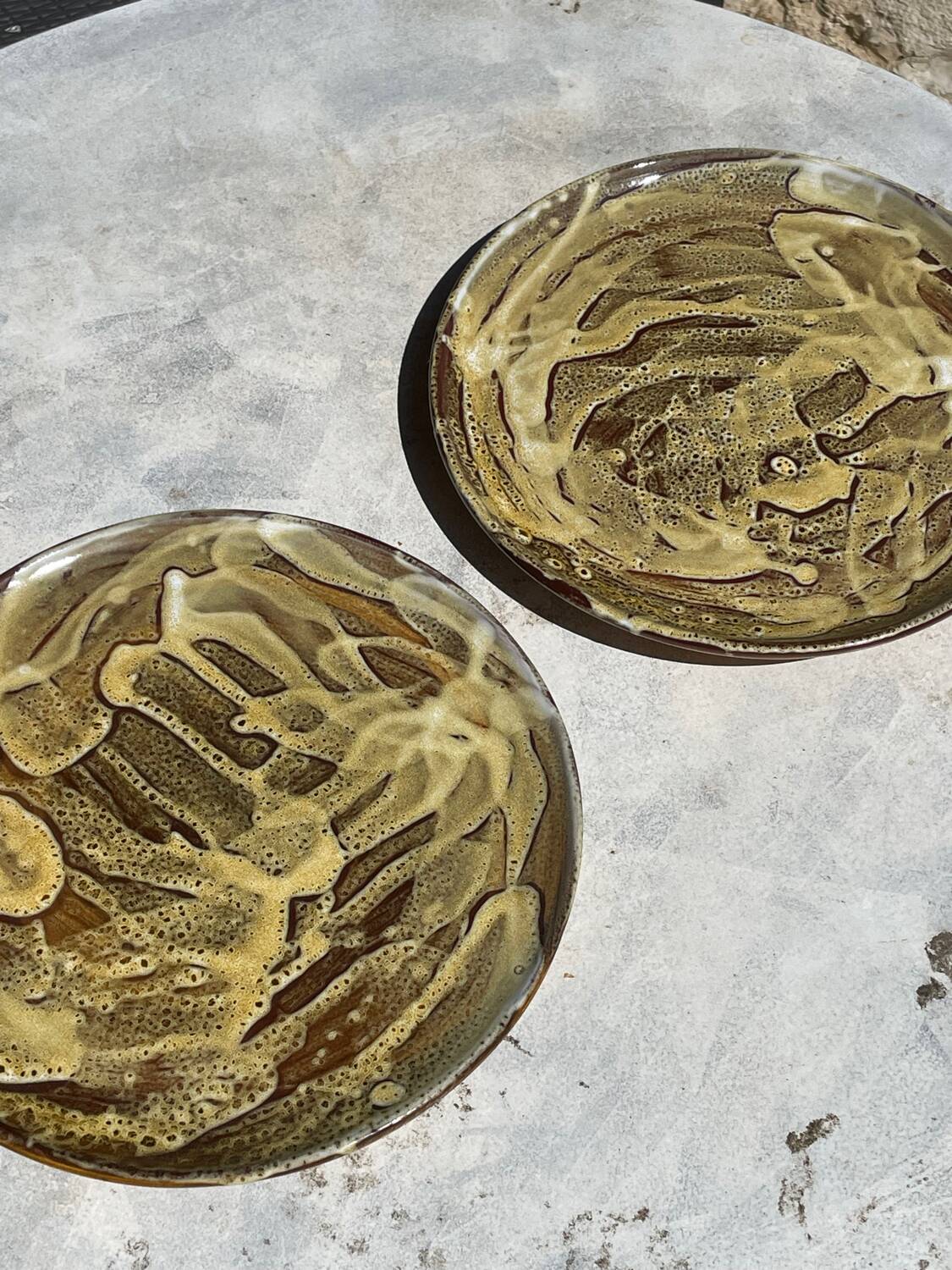 Pair of green glazed stoneware ceramic plates