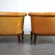 Unique old set of 2 club armchairs and a couch in cognac-colored leather with wheels