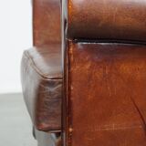English style sheepskin leather wingback chair in a cognac color