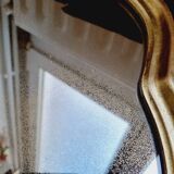Free form mirror in golden wood