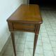 Extendable console table in cherry wood.