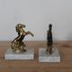 Pair of vintage bookends with rearing horses in gilded metal on marble bases.