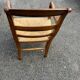 Louis Philippe country armchair in solid wood and straw, hooked armrests