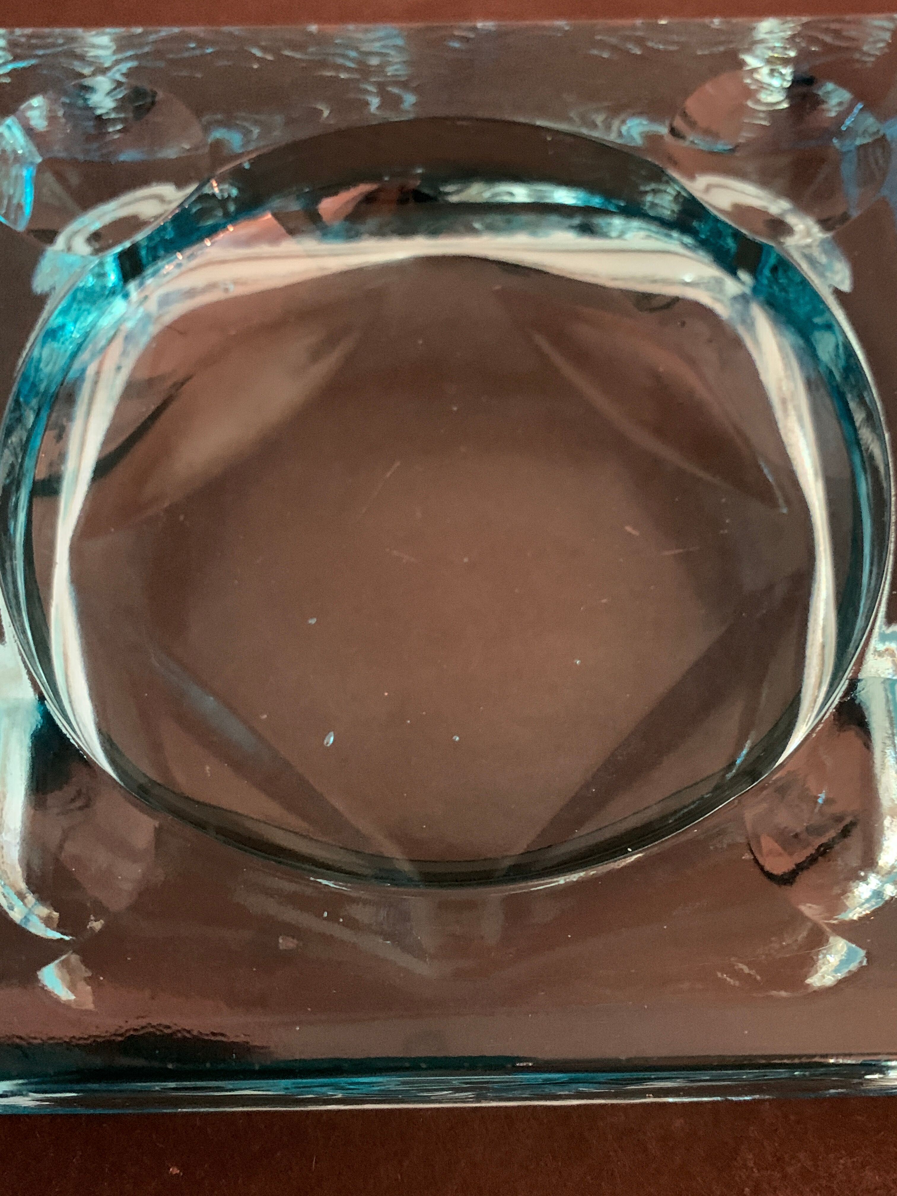 Ashtray paved in blue glass
