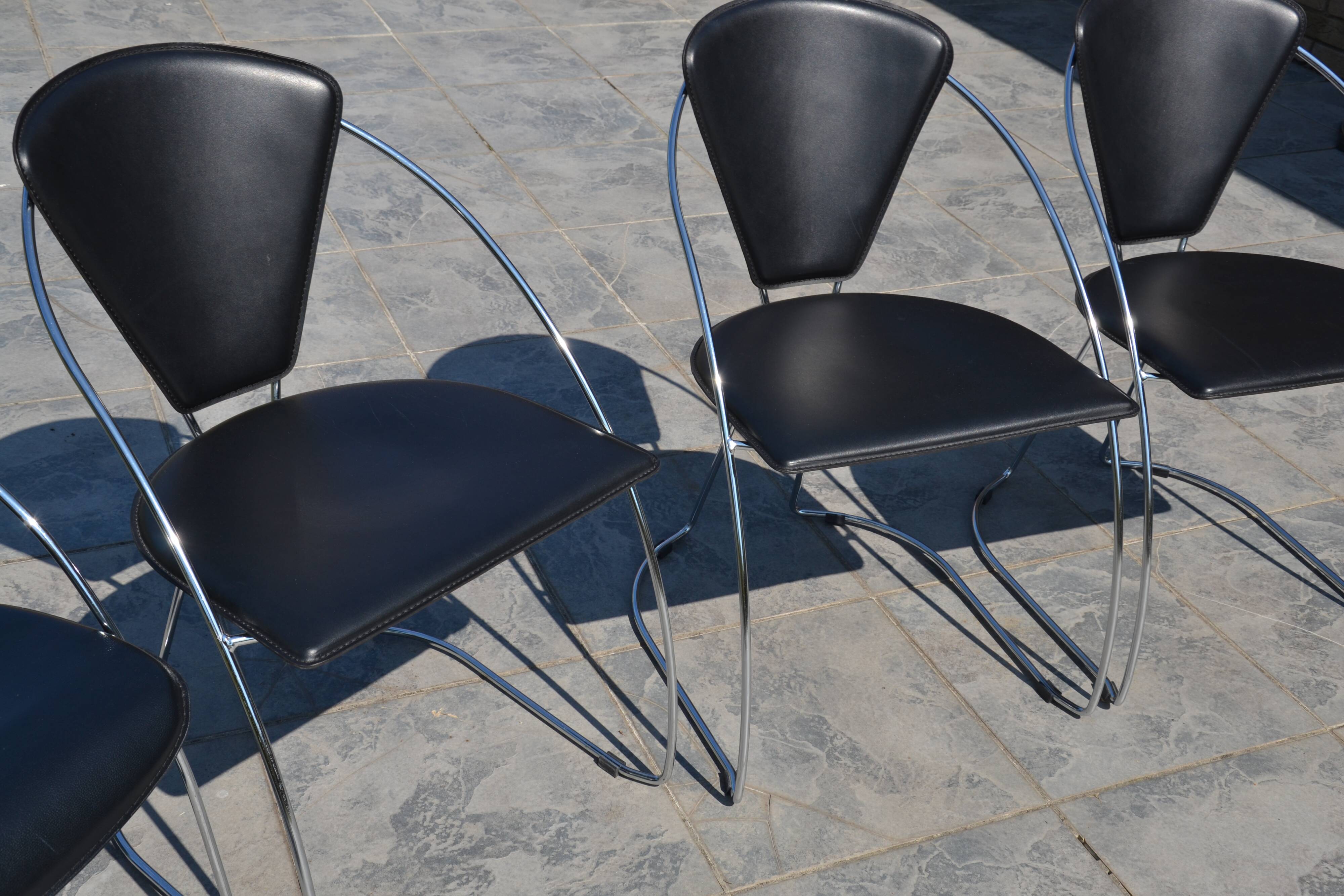 4 chrome and leather chairs designed by Italy
