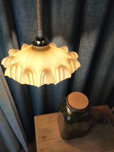 Suspension with draped yellow glass lampshade