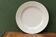 Old white porcelain dish, AH et Cie