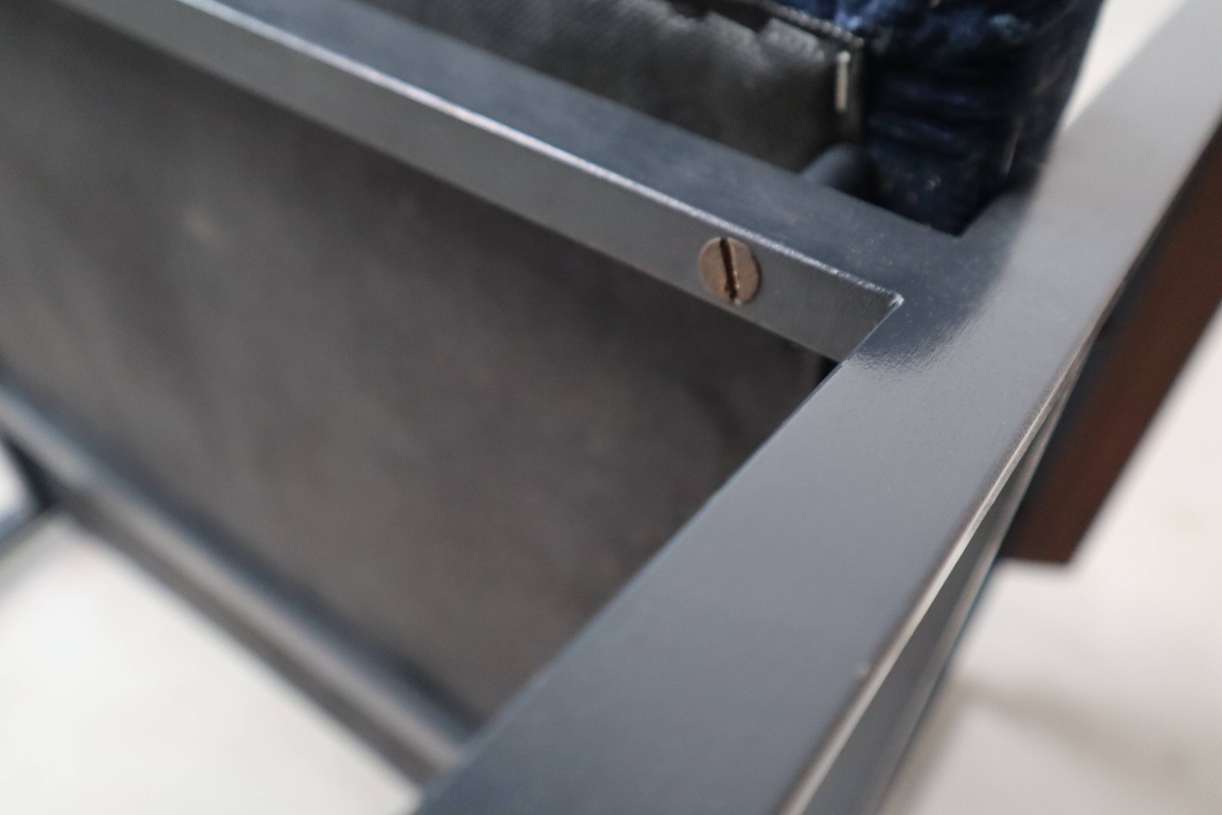 Pair of Postmodern armchairs in steel and mahogany, 1970s