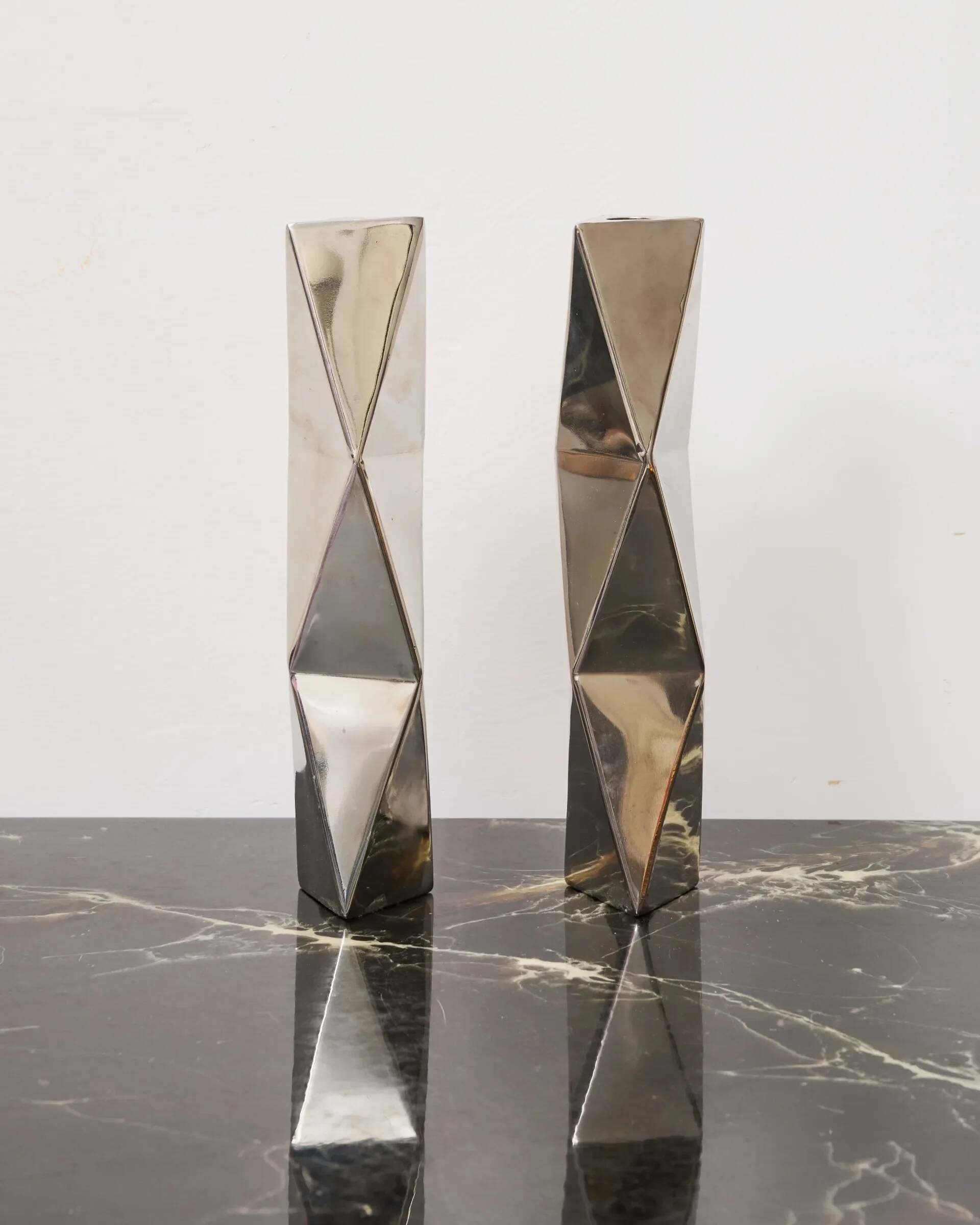 "Origami" pair of candlesticks in aluminium cast, 1970s
